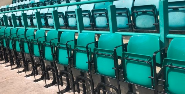 Green seats with armrests at Easter Road Stadium